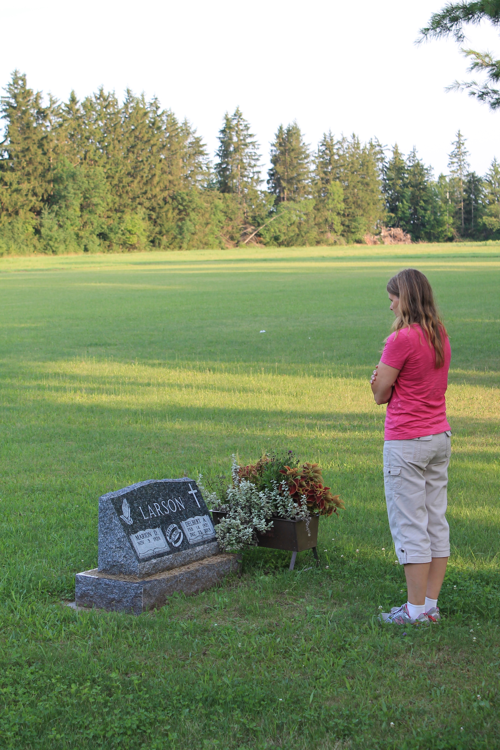 Doris standing by her Dad's grave