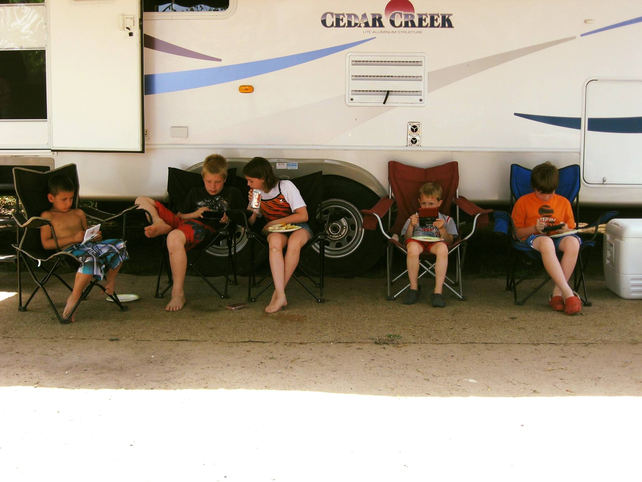 Camping at Lake Chippewa the summer of 2010. Swimming, fishing, tubing, and the kids playing their Nintendos under the awning of our big old camper. What a great memory!